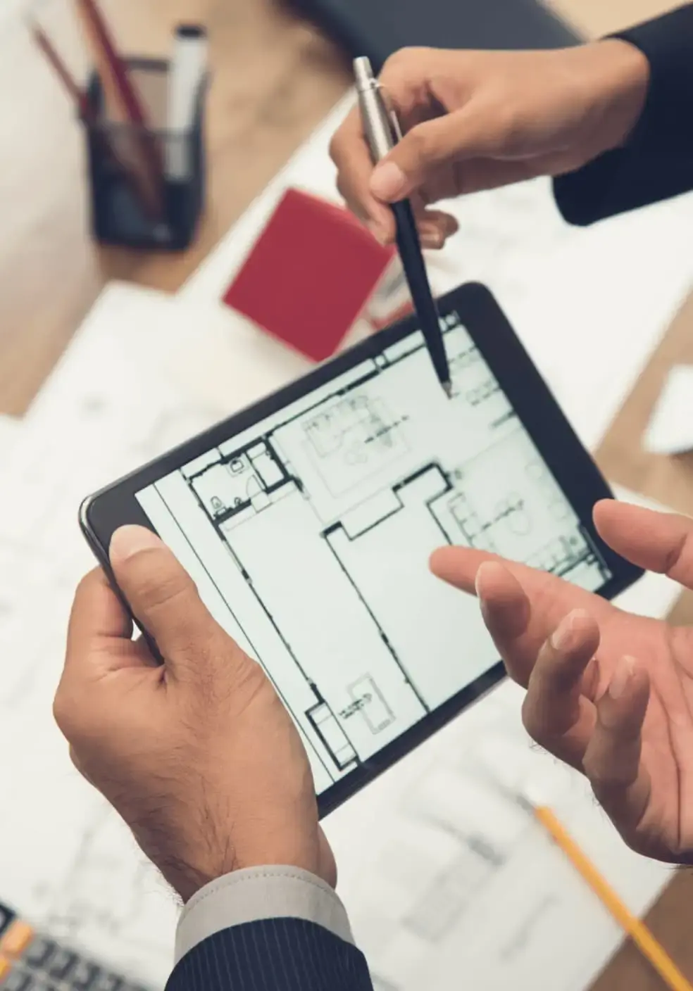 Architects looking a building plan on a tablet
